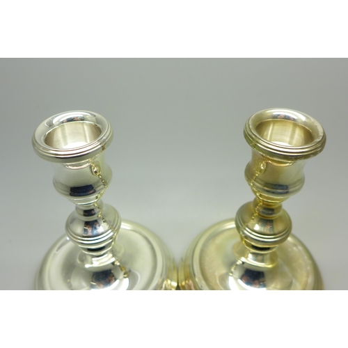 916 - A pair of small silver candlesticks, 11cm