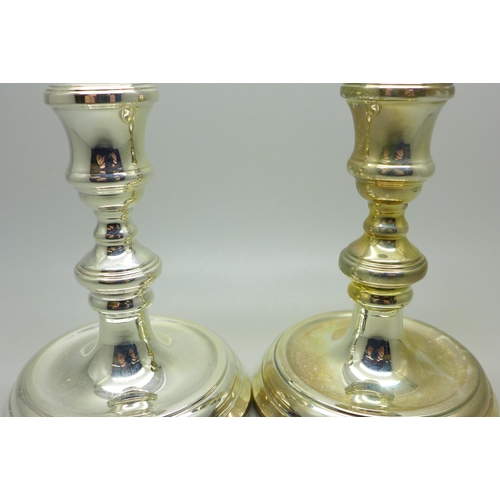 916 - A pair of small silver candlesticks, 11cm