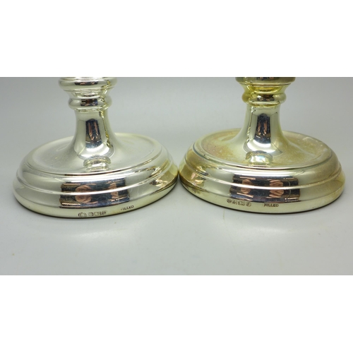 916 - A pair of small silver candlesticks, 11cm