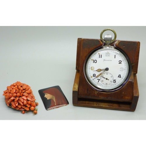 917 - A Helvetia pocket watch and stand, a coral brooch and a portrait panel, Saint Fabiola after Jean-Jac... 