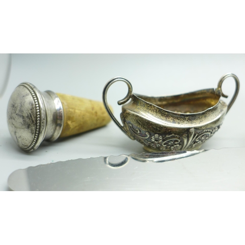 925 - A collection of silver and silver mounted items including silver handled implements, silver bangle, ... 