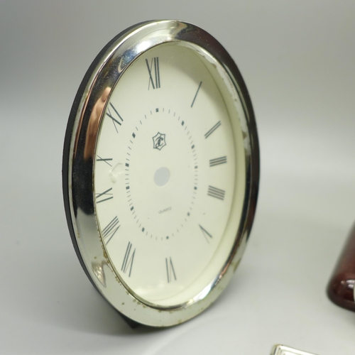 926 - A silver fronted clock case, (no movement), one other case and a plaque