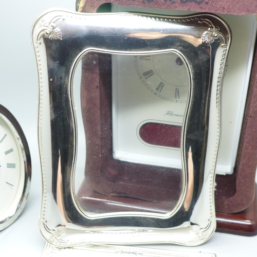 926 - A silver fronted clock case, (no movement), one other case and a plaque