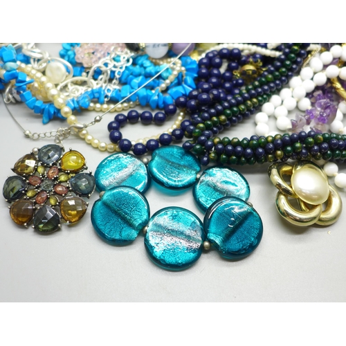 945 - A collection of bead necklaces and bracelets including semi-precious stones, etc.