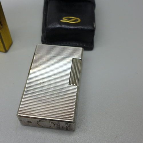 946 - Four lighters; two Dunhill, one Dupont and a silver plated Zippo