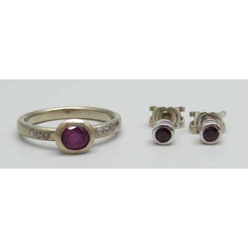 976 - A 14ct white gold, diamond and ruby ring, M, and a pair of 18ct white gold and ruby stud earrings, 4... 