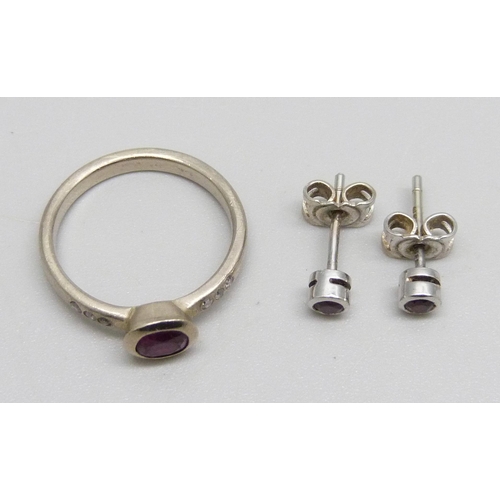 976 - A 14ct white gold, diamond and ruby ring, M, and a pair of 18ct white gold and ruby stud earrings, 4... 