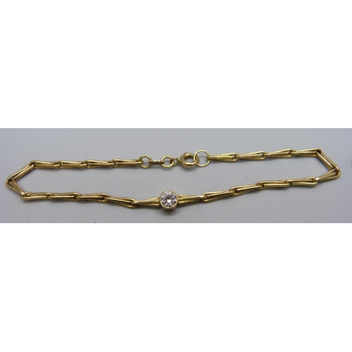 977 - An 18ct gold and white stone bracelet, 20.5cm, 7.1g, and a 9ct gold earring, 0.5g