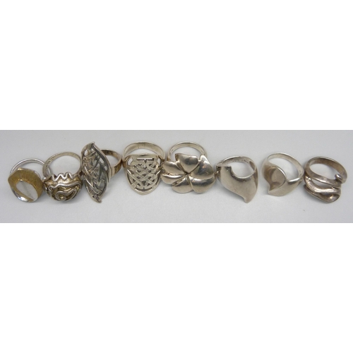 979 - Seven silver large chunky rings, and one unmarked white metal ring, up to 38mm, 71g