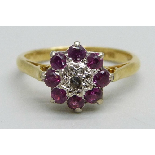 980 - An 18ct gold, diamond and ruby cluster ring, 3.4g, M