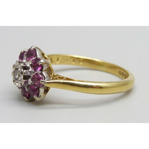 980 - An 18ct gold, diamond and ruby cluster ring, 3.4g, M