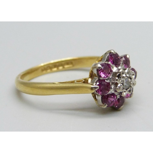 980 - An 18ct gold, diamond and ruby cluster ring, 3.4g, M