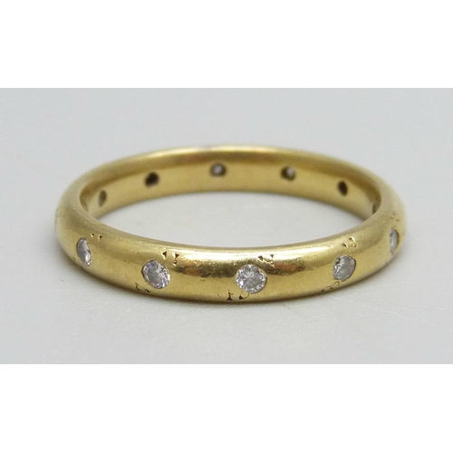 984 - An 18ct gold wedding band set with 12 diamonds, 3.9g, N