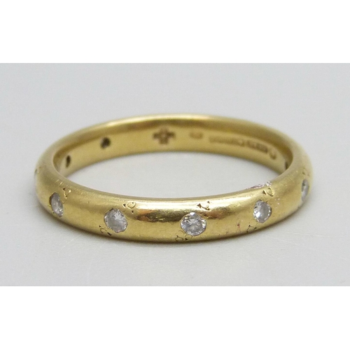 984 - An 18ct gold wedding band set with 12 diamonds, 3.9g, N