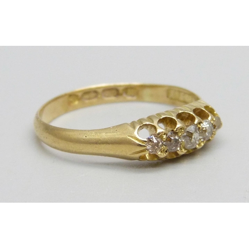 985 - An 18ct gold ring set with five diamonds, 2.1g, M