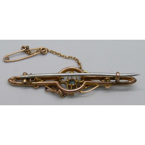 993 - A 9ct gold bar brooch set with a paste stone and seed pearls, metal pin, 2.7g, 5cm