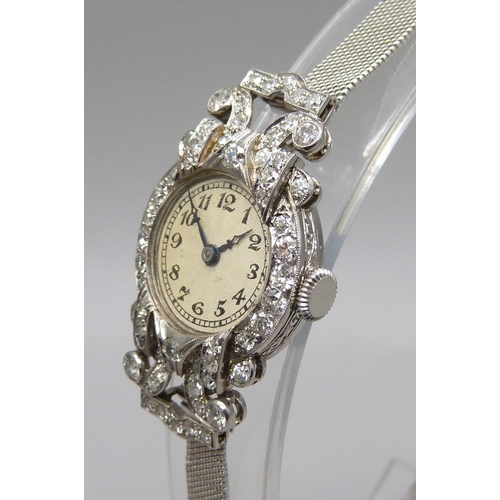 997 - A lady's Art Deco platinum and diamond set cocktail wristwatch, inscription to case back 'D.M.S. 2:1... 