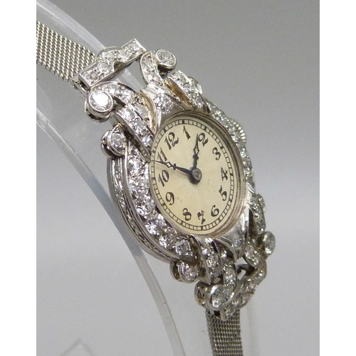 997 - A lady's Art Deco platinum and diamond set cocktail wristwatch, inscription to case back 'D.M.S. 2:1... 