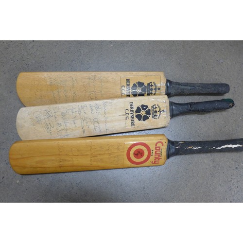 837 - Four autographed cricket bats, the large one with Leics., Surrey, Derbys., Lancs., Notts. and Yorks.... 