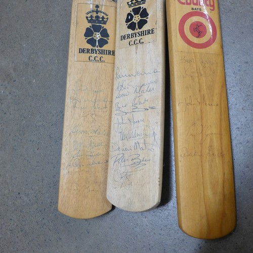 837 - Four autographed cricket bats, the large one with Leics., Surrey, Derbys., Lancs., Notts. and Yorks.... 