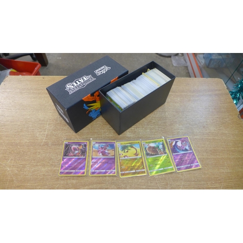 2128 - A box of over 500 Pokemon trading cards