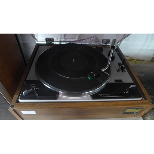 2164 - A Sony 230 stereo turntable system, STR-6046A solid state amplifier/radio and a pair of Sony speaker... 