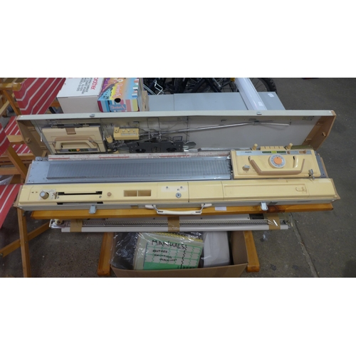 2205 - A Brother knitting machine (model:- KH-830) - with attachments and wool