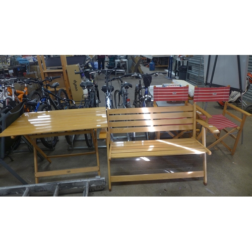 2206 - A folding patio dining set including table, two folding chairs and a folding bench