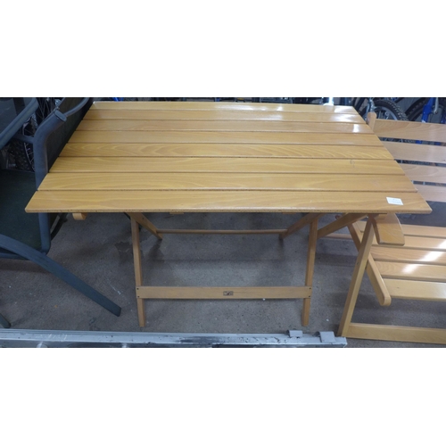 2206 - A folding patio dining set including table, two folding chairs and a folding bench