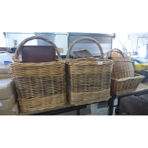 2391 - Four wicker shopping baskets and two small brown leather briefcases