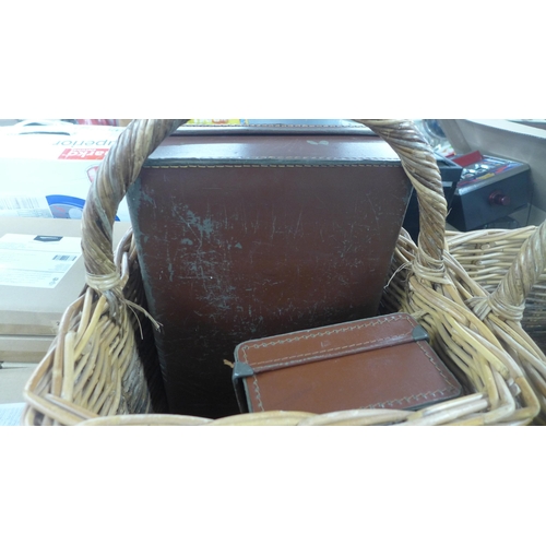 2391 - Four wicker shopping baskets and two small brown leather briefcases