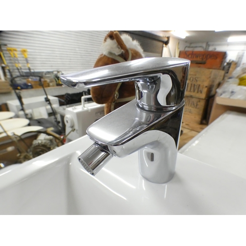 2308 - A ceramic Roca Nexo floor standing bidet with chrome mixer tap