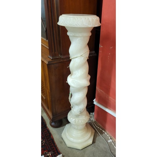 192A - A French onyx barleytwist jardiniere stand