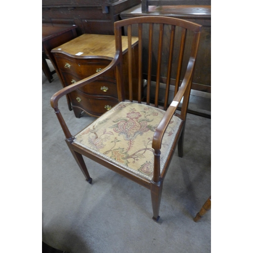 100 - An Edward VII inlaid mahogany elbow chair