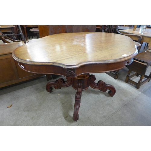 129 - A 19th Century French walnut serpentine centre table