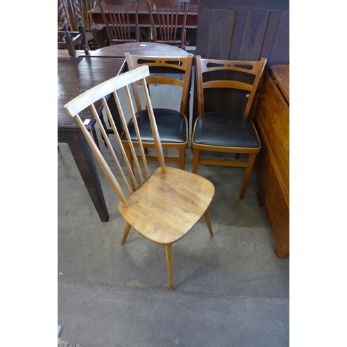 137 - An Ercol Blonde elm and beech chair and a pair of beech kitchen chairs