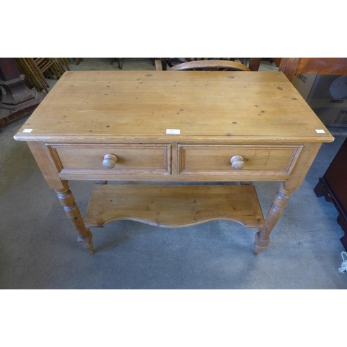 139 - A Victorian style pine two drawer kitchen serving table