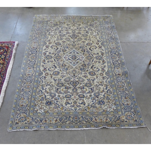 149 - An eastern cream ground rug, 235 x 142cms