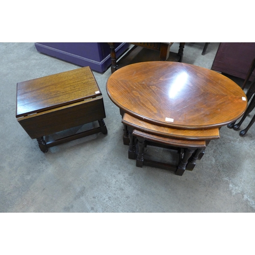 164 - An oak drop-leaf occasional table and a beech oval nest of tables