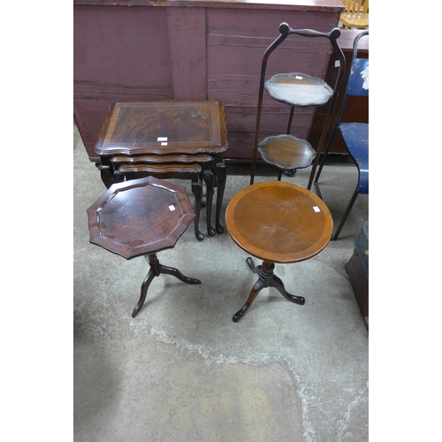 165 - A mahogany nest of tables, two mahogany wine tables and an oak cakestand