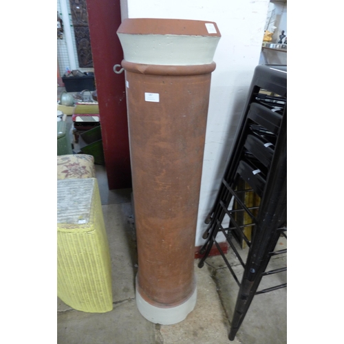 187 - A tall terracotta chimney-pot