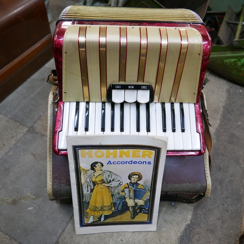 204 - A cased Hohner accordion