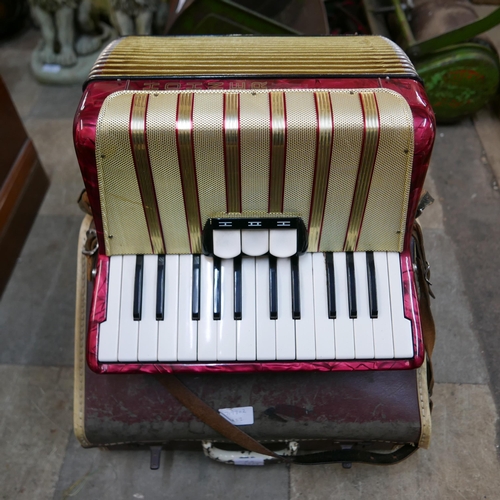 204 - A cased Hohner accordion