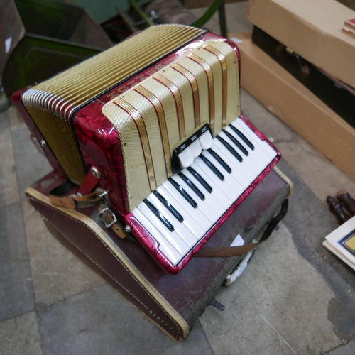 204 - A cased Hohner accordion