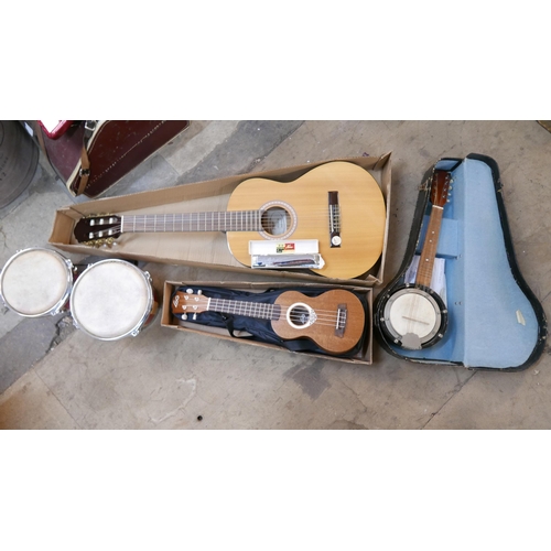 209 - A Hofner guitar, a ukulele, pair of bongo drums, a banjo and a Haro harmonica