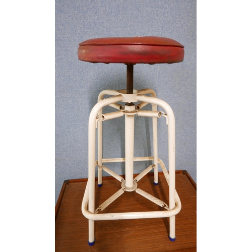 220 - An industrial sprung metal stool