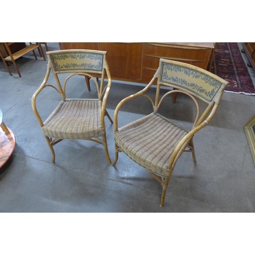 26 - A pair of Italian bamboo and rattan elbow chairs