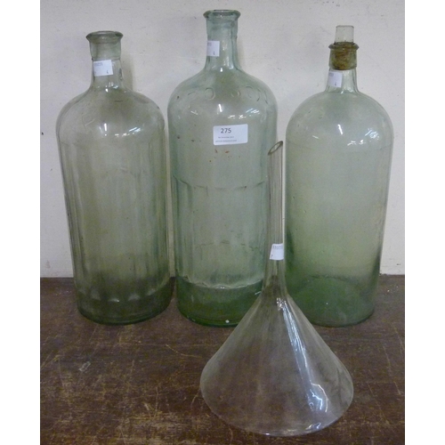 275 - Three vintage glass poison bottles and a funnel