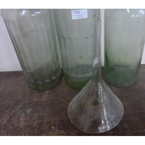 275 - Three vintage glass poison bottles and a funnel