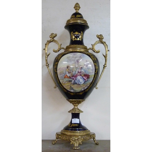 283 - A French Sevres style cobalt blue porcelain and gilt double handled vase and cover